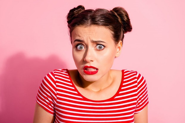 Close up photo beautiful she her lady pretty buns unexpected news big eyes opened mouth speechless oh no face awkward shame eyes wear casual striped red white t-shirt isolated pink background. uh oh not sure facial expression