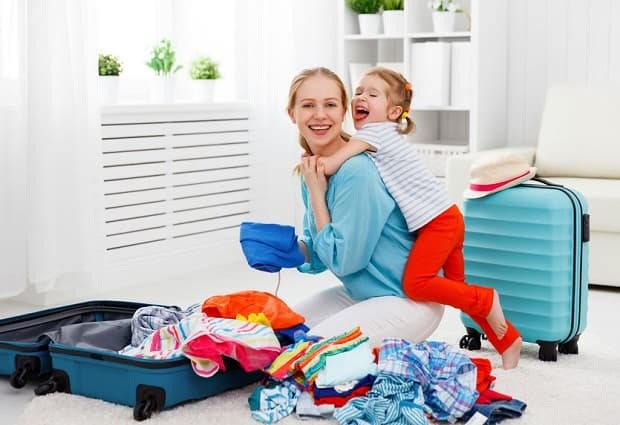 happy family tourist mother and child daughter suitcases packed for vacation luggage