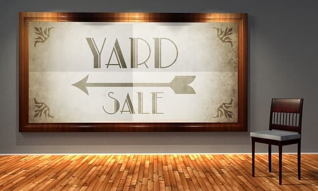 Yard sale vintage direction sign in old fashioned frame, retro interior
