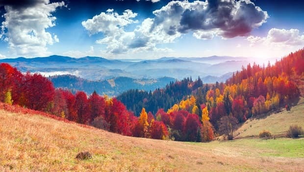 Colorful autumn landscape in the mountain village. Foggy morning in the Carpathian mountains. Sokilsky ridge, Ukraine, Europe.