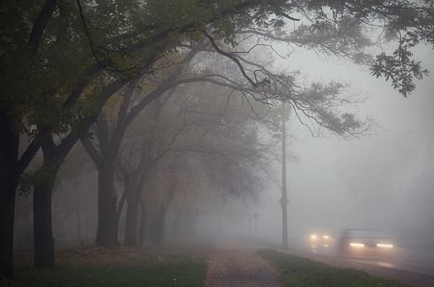 Fog and drizzle in the city an autumn day